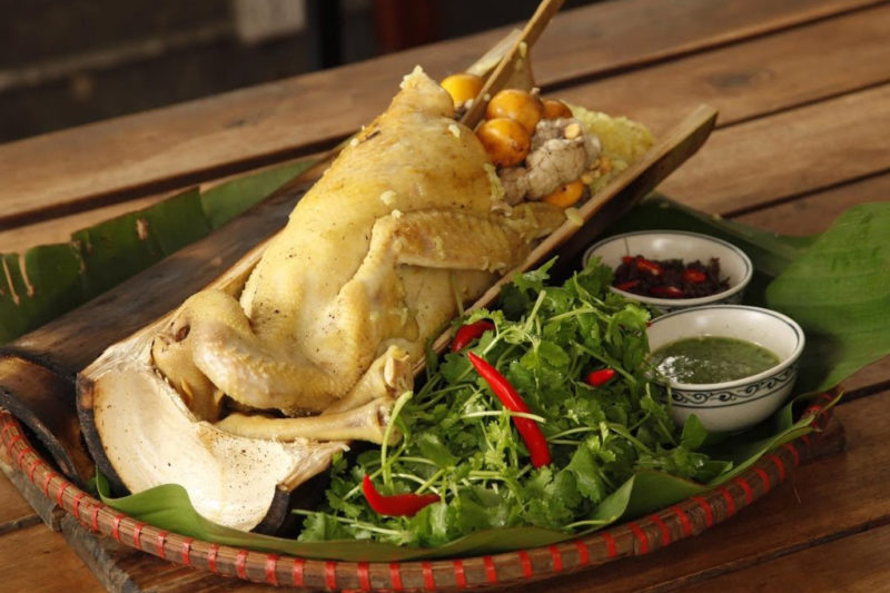 chicken cooked inside a bamboo