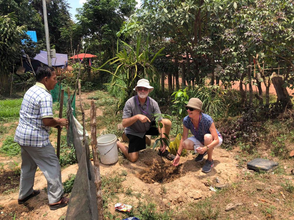 sens-guests-planting-a-tree-in-cycling-angkor-tour